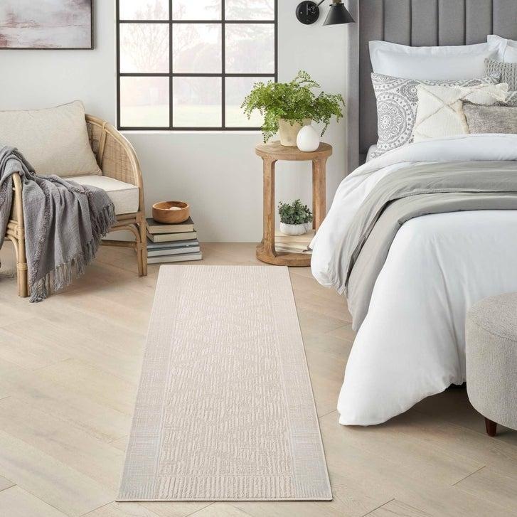 Arctic Ivory 9x12 — Costco Arctic collection — Lumi Ivory design example. Runner pictured; pallet design and 9×12 variant remain unverified.