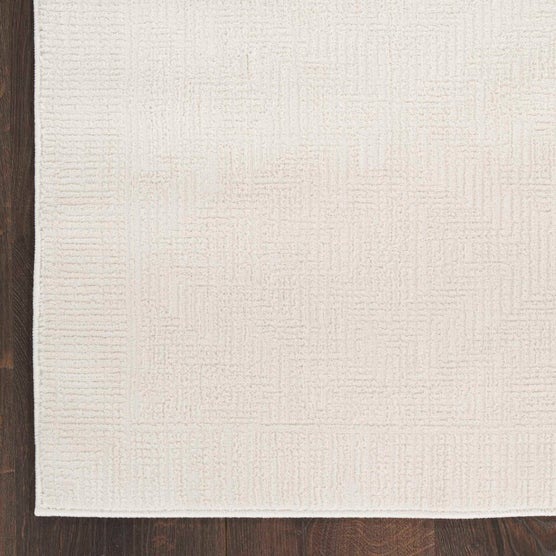 Arctic Ivory 9x12 — Costco Arctic Lumi collection example: runner room photo and 9×12-named texture detail. Exact pallet design unverified.